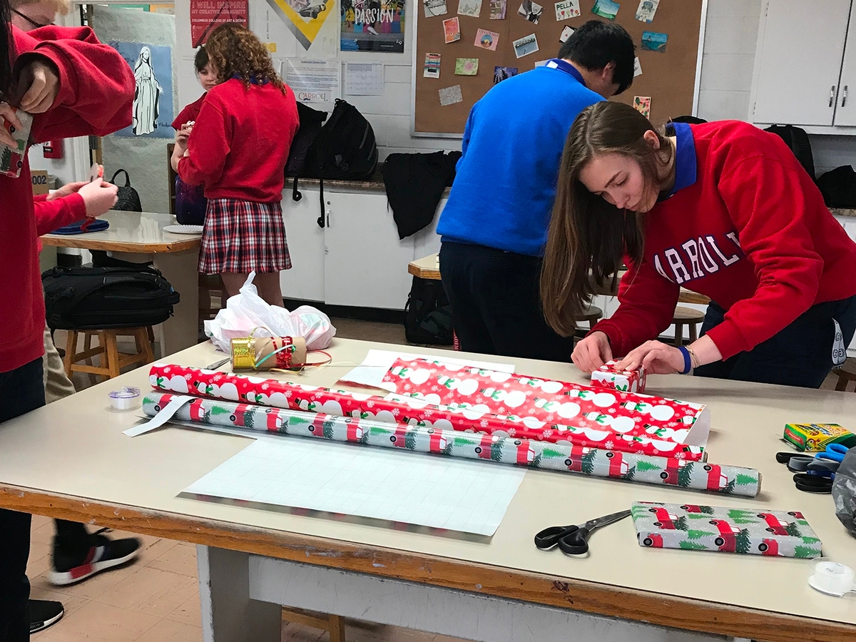 National Art Honor Society Students prepare and wrap Christmas gifts