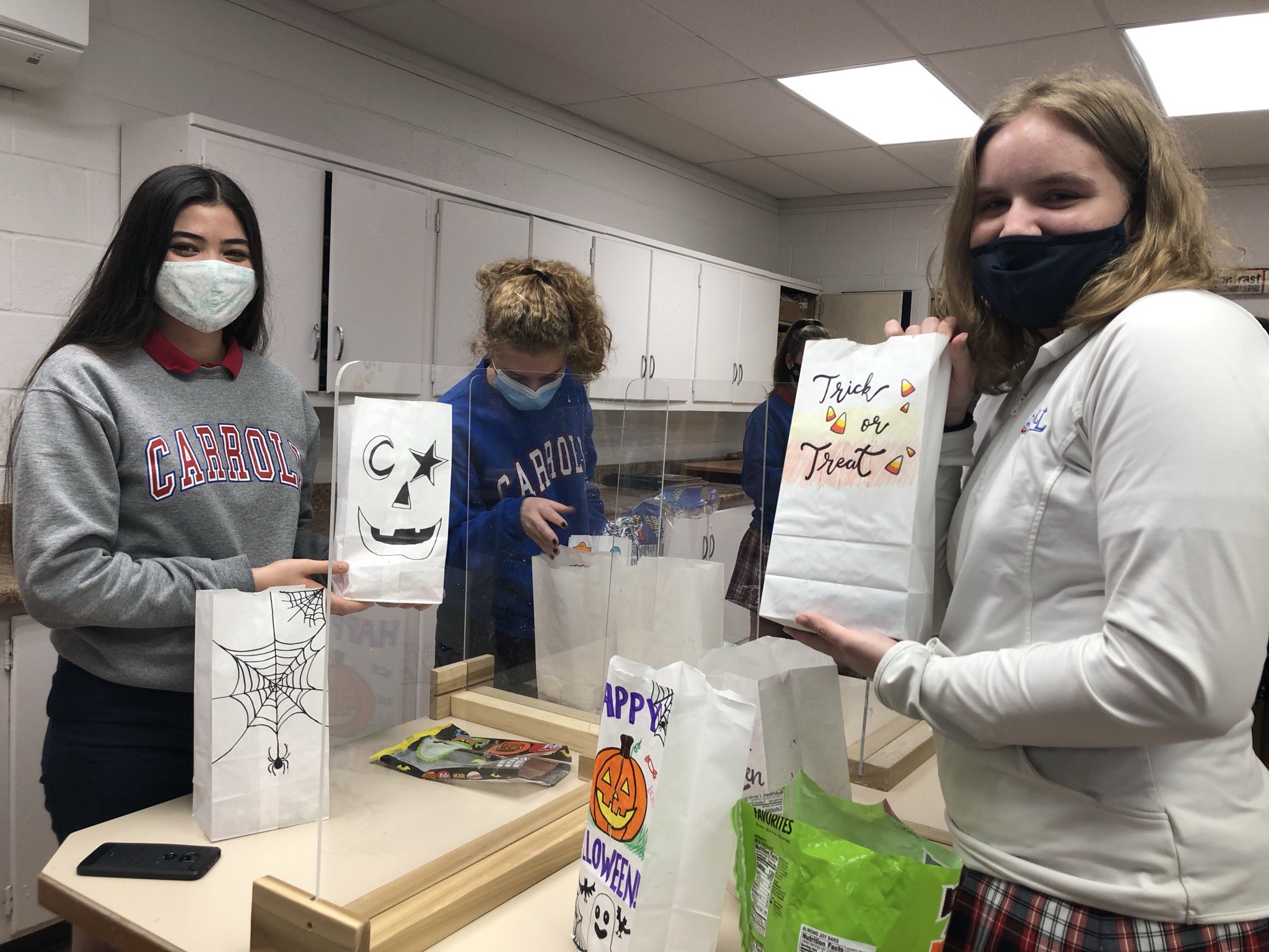 National Art Honor Society students decorate and fill Halloween candy bads==gs.